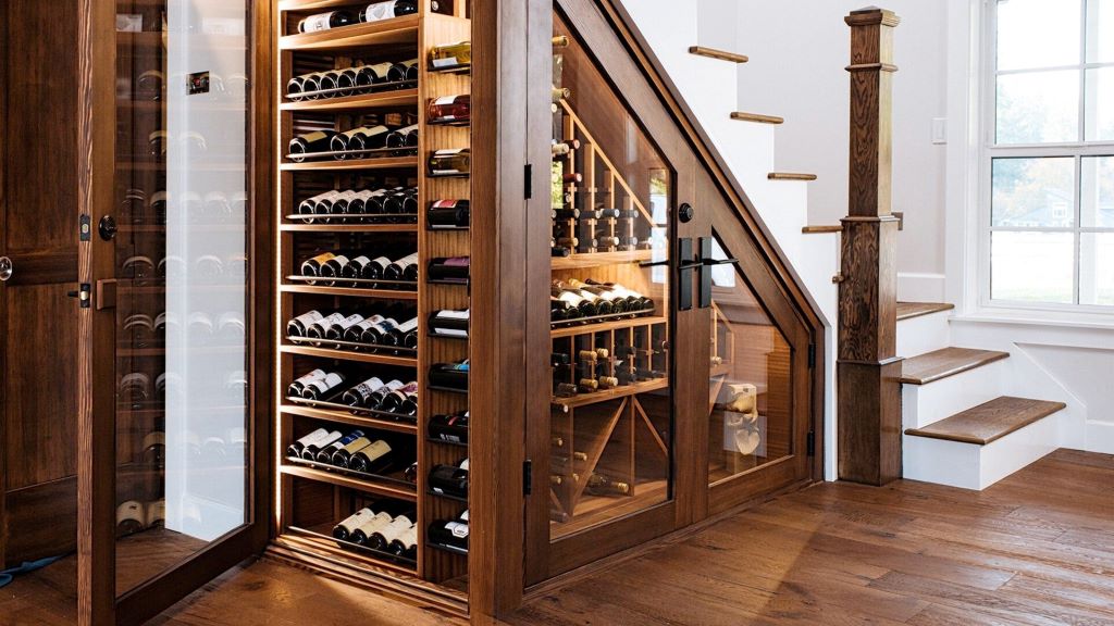 Wine bottles neatly stored in a temperature-controlled home wine cellar